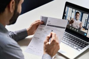 Demand for new hires as man interviewing candidate virtually